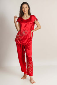 Red satin pyjama suit with floral embroidery, elegant and stylish design.
