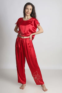 Elegant red pyjama suit with floral design for women.