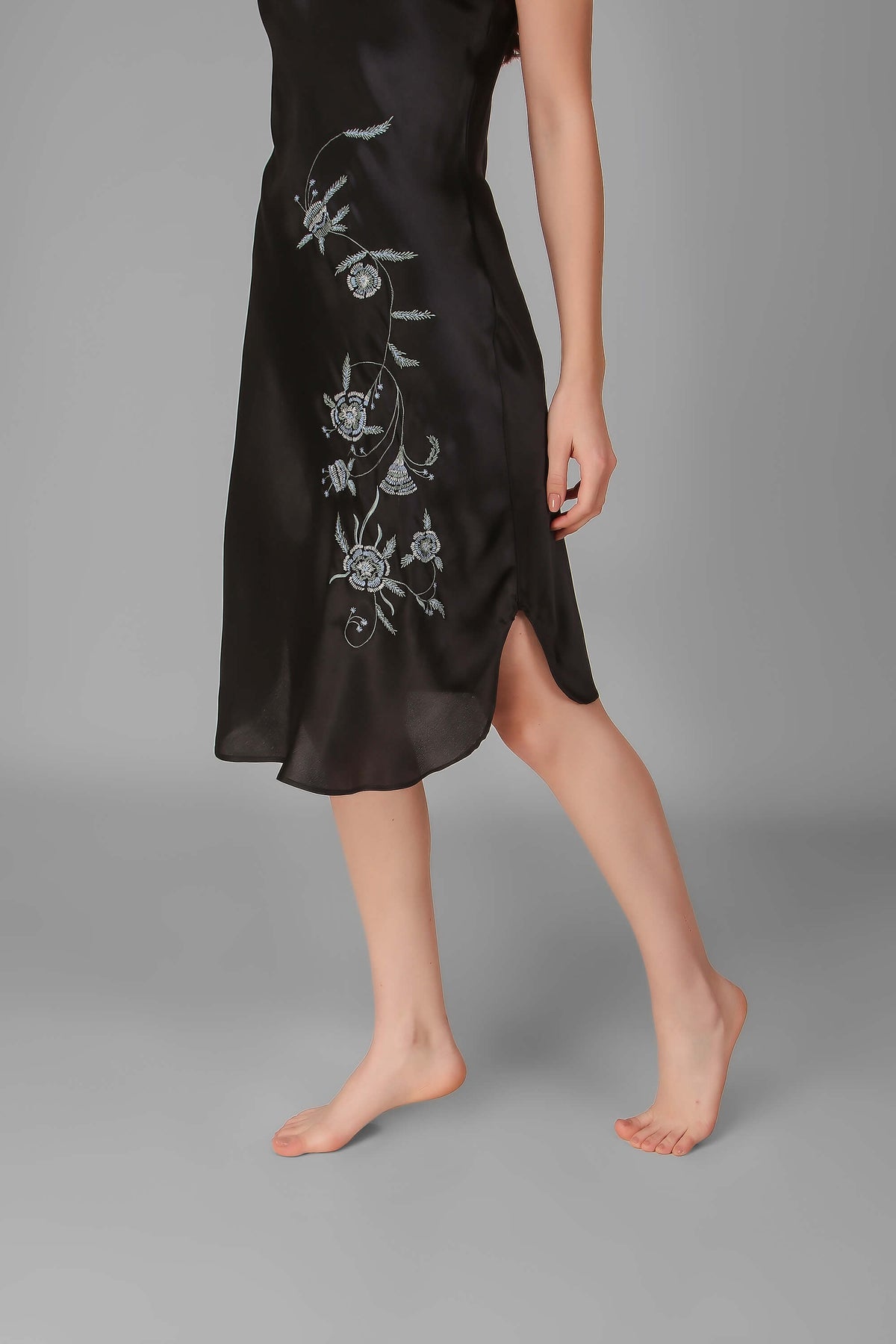 Elegant black Andromeda dress with floral embroidery, perfect for occasions.