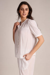 Cecilia Pyjama Suit model showcasing elegant white loungewear outfit.