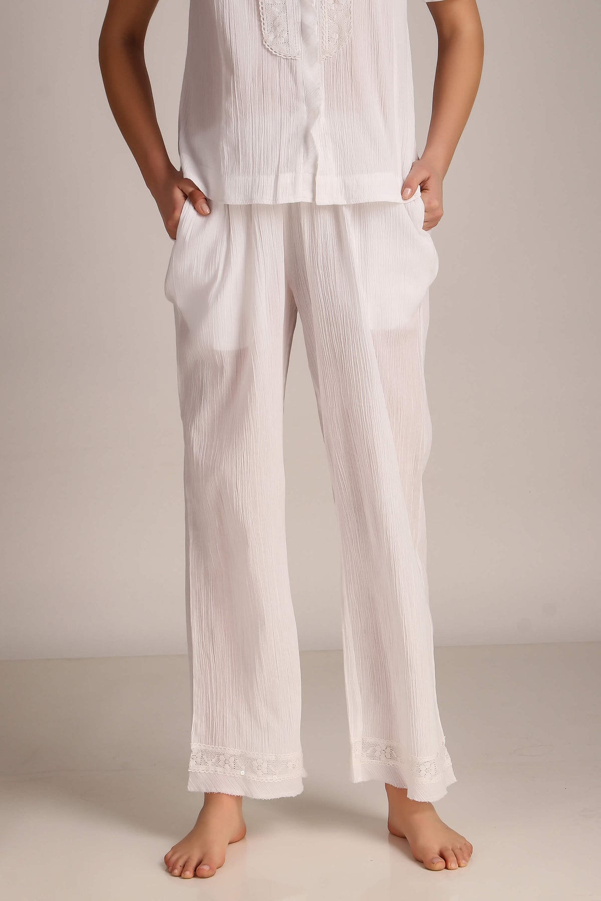 Cecilia pyjama suit in soft white fabric for comfortable lounging.