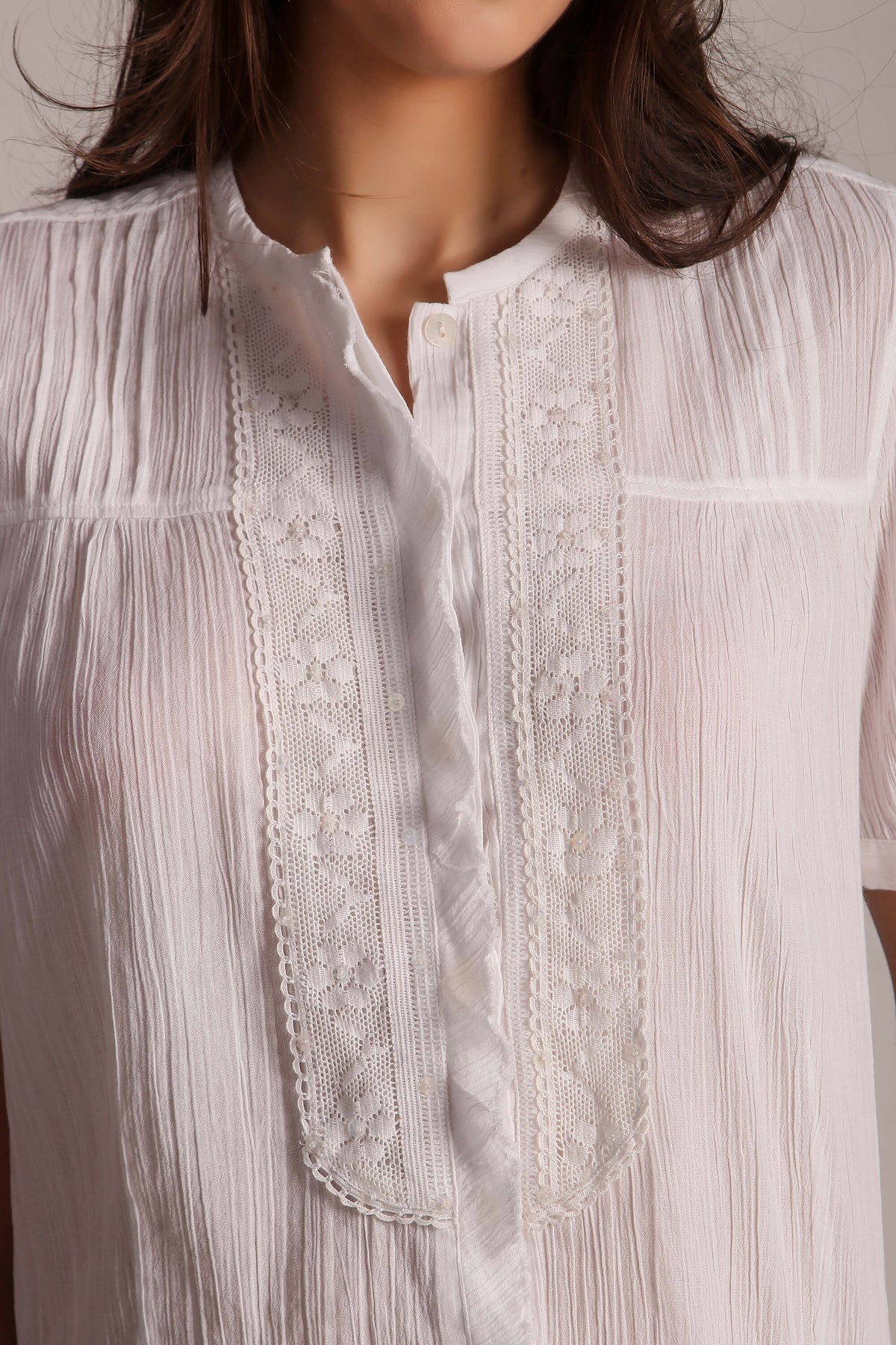 Cecilia Pyjama Suit featuring lace detail and textured fabric.