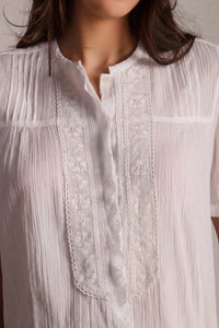 Cecilia Pyjama Suit featuring lace detail and textured fabric.