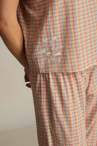 Colorful Haylee pyjama suit with floral embroidery detail.