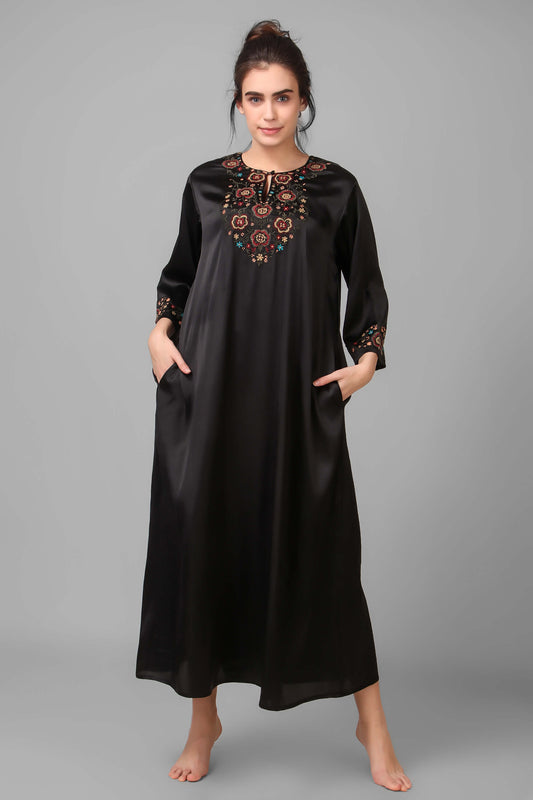 Boho-chic embroidered kaftan dress with pockets and floral design.