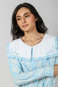 Sailor style pyjama suit in soft blue with floral details.