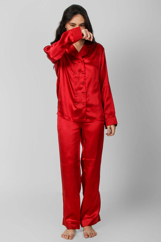 Elegant red satin pyjama suit for stylish lounging and sleep.