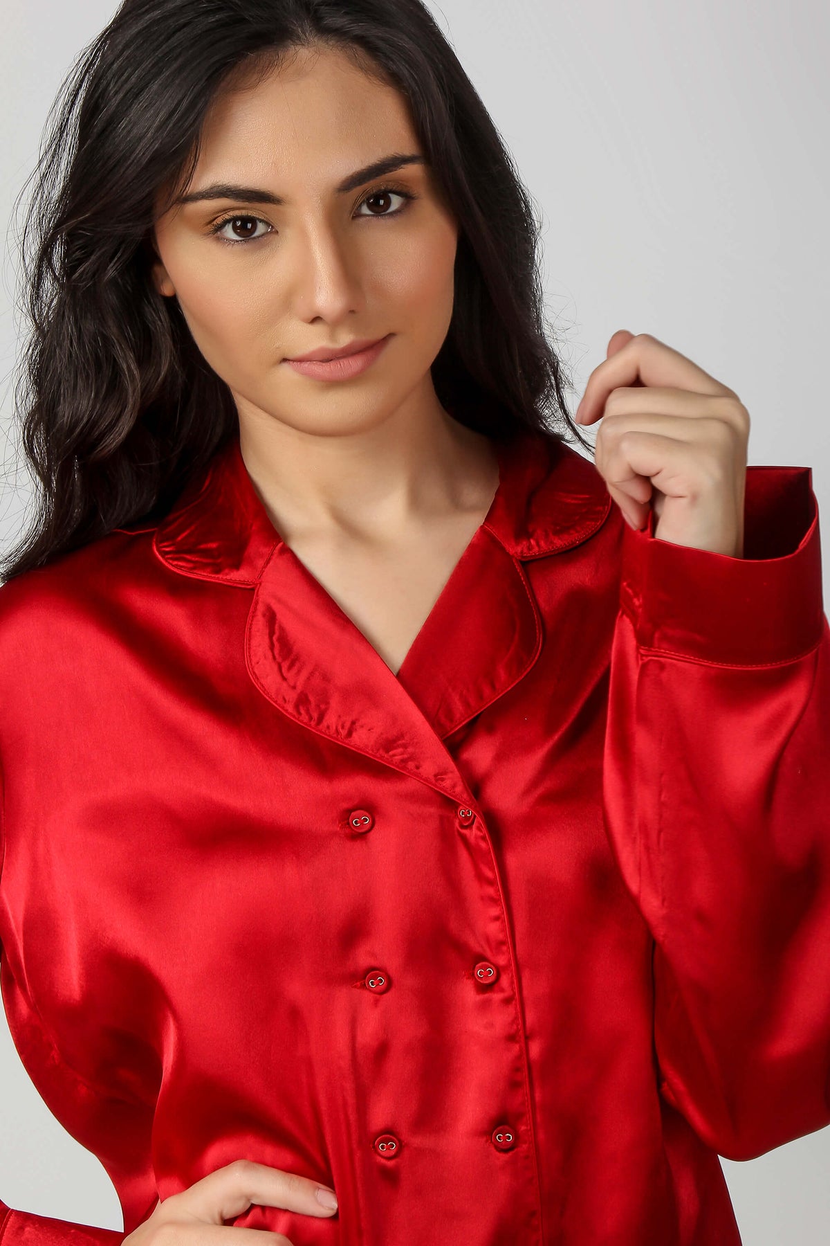 Elegant woman modeling red satin Rachel Pyjama Suit.