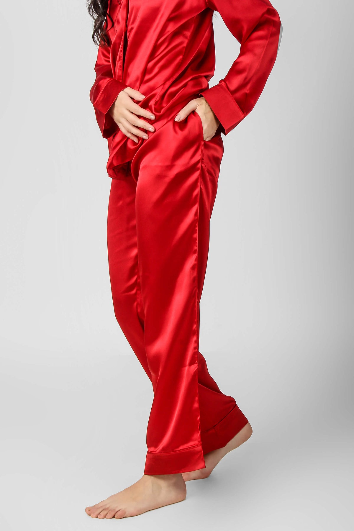 Elegant red satin pyjama suit for women, stylish and comfortable.