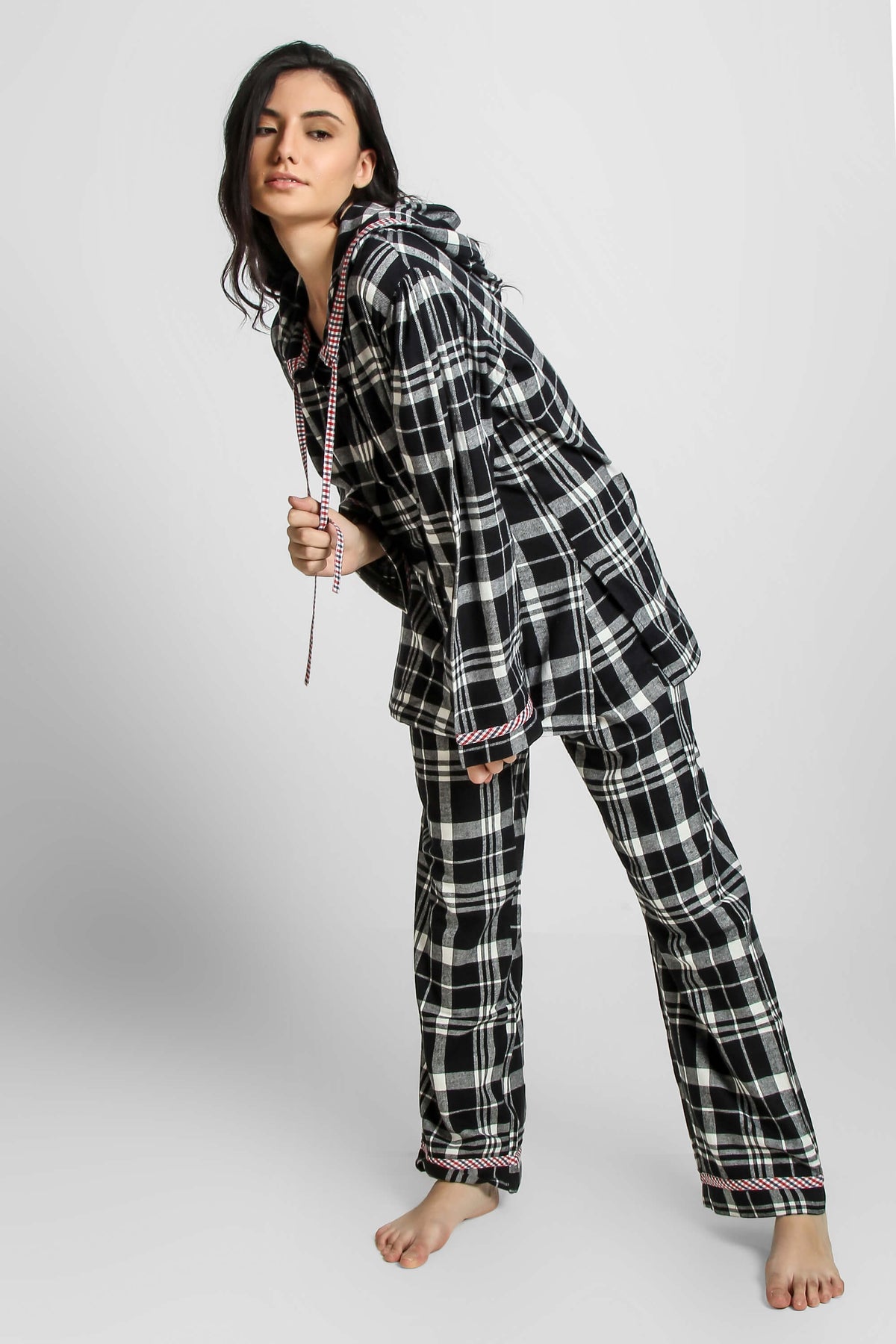 Woman modeling stylish plaid Griffin hoodie pyjama suit.