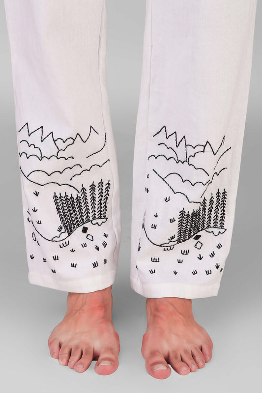 Tatra unisex pyjamas with embroidered mountain and forest designs.