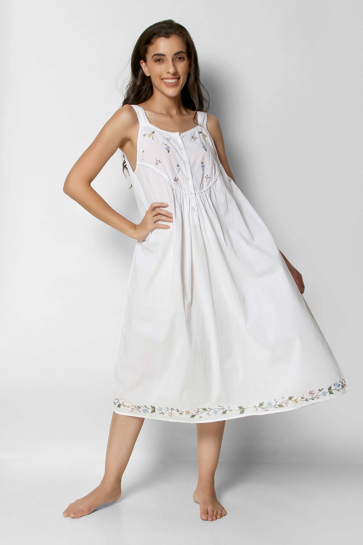 Elegant white nightdress with floral embroidery for comfortable sleepwear.