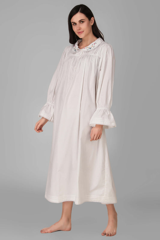 Elegant white nightdress with floral collar and ruffled sleeves.
