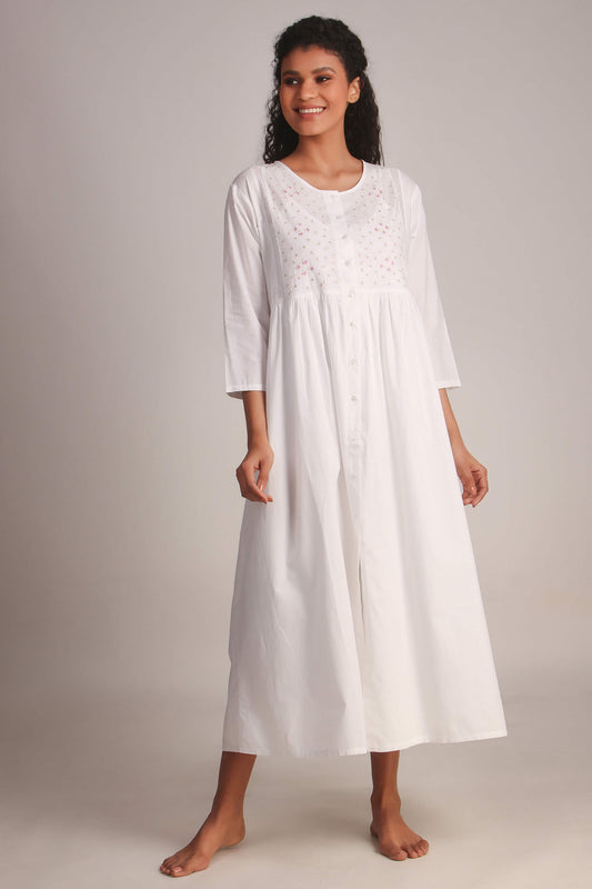 Elegant white nightdress and gown with embroidered details. Perfect for comfort.