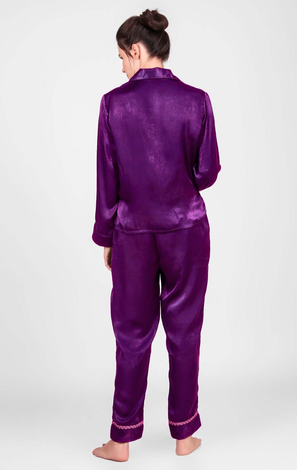 Purple satin pyjama suit for women, stylish and comfortable design.