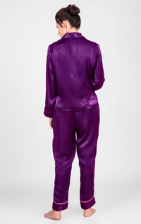 Purple satin pyjama suit for women, stylish and comfortable design.