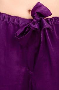 Purple satin pyjama suit with bow detail, stylish and comfortable.