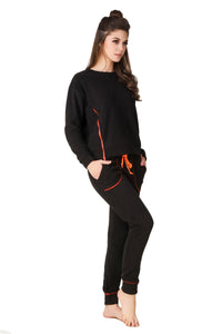 Stylish black pajama suit with vibrant orange accents for women.