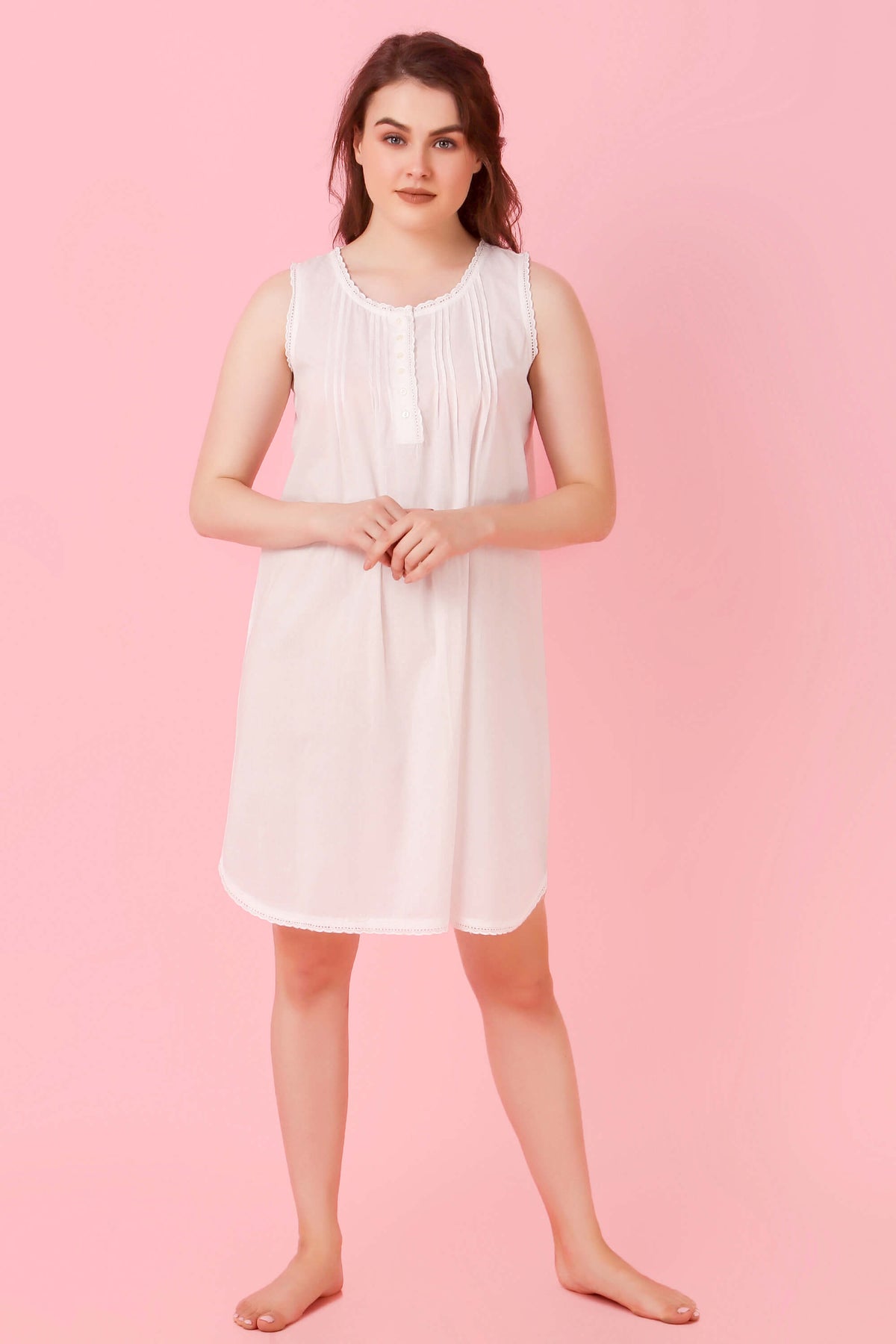 Model wearing Jia nightdress on a pink background.