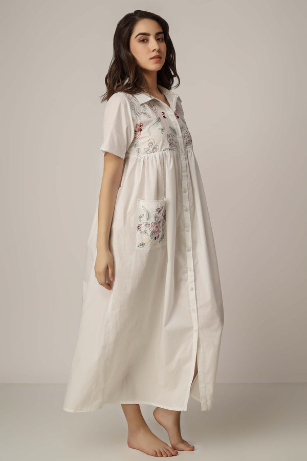 Bailey front open dress with floral embroidery and button-down design.