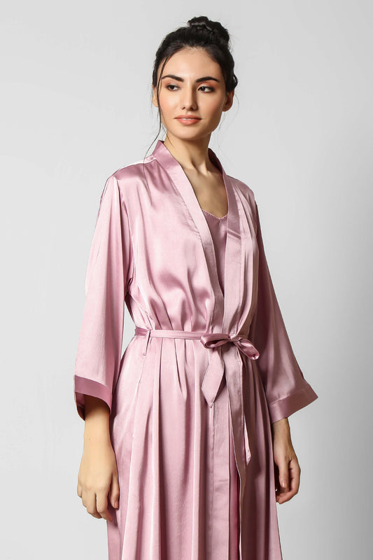 Elegant pink silk gown with belt, perfect for loungewear.