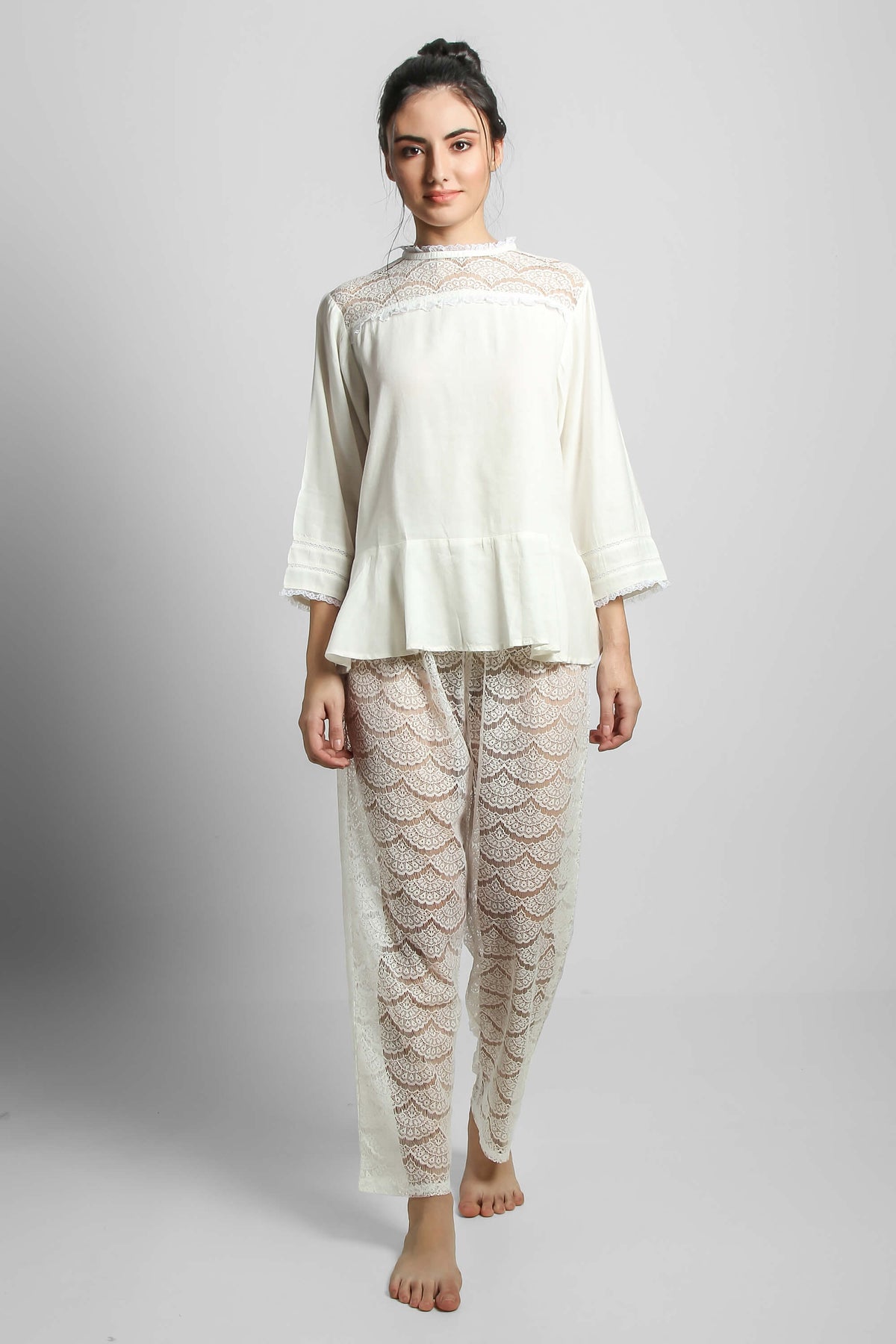 Georgina lace pyjama suit featuring elegant shorts and top.