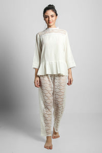 Georgina lace pyjama suit featuring elegant shorts and top.