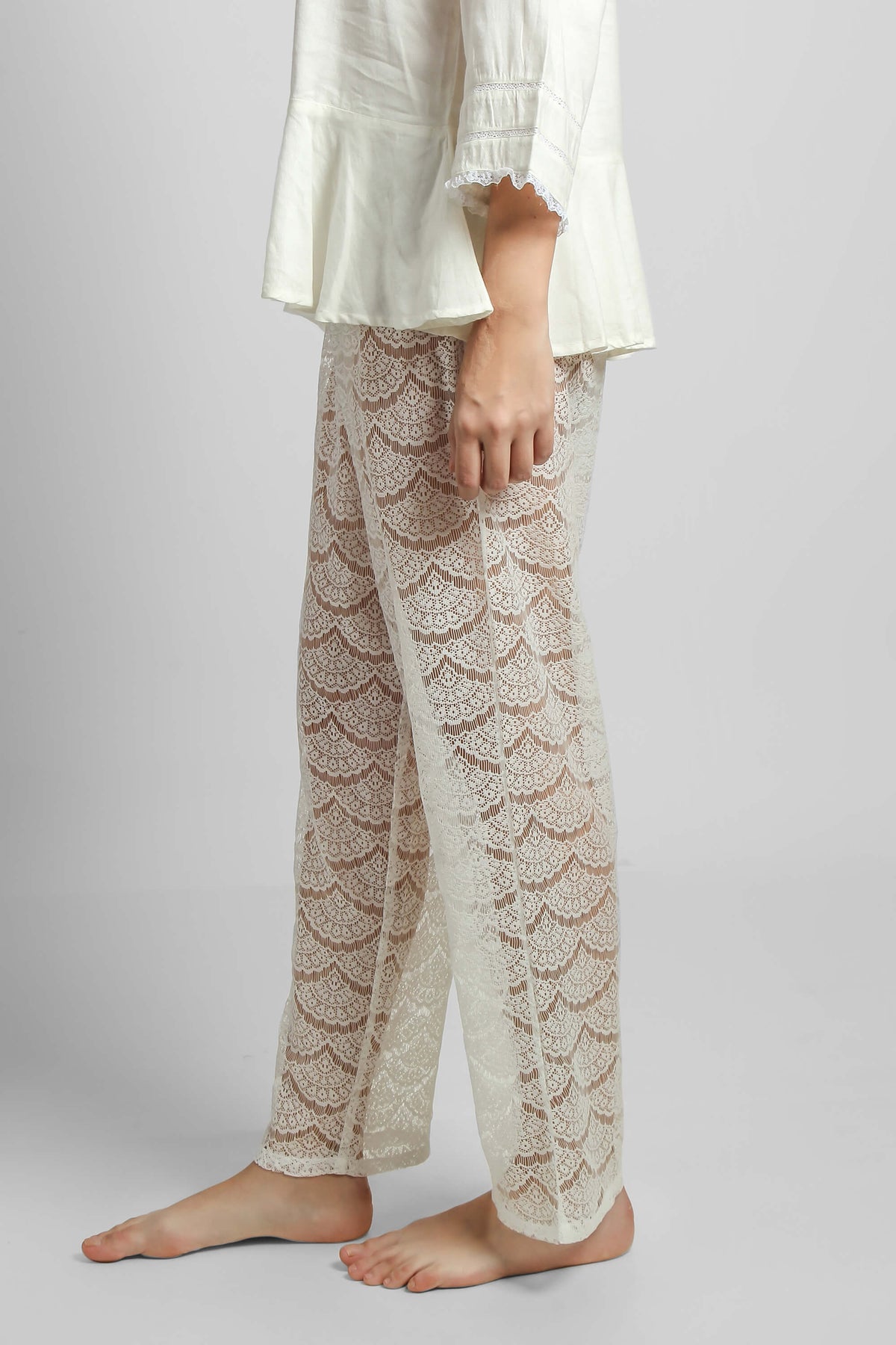 Elegant lace pyjama suit featuring stylish shorts and top.