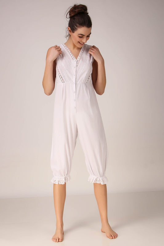 White Enola romper with lace detailing and button front.