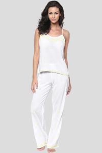 Stylish white Misha pyjama suit with yellow accents for comfort.