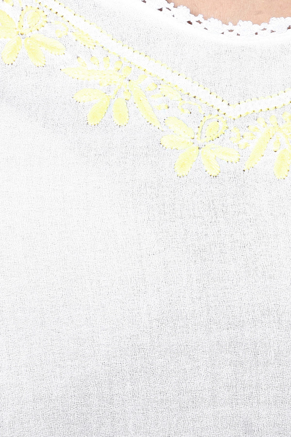 Misha Pyjama Suit with floral yellow embroidery detail on white fabric.