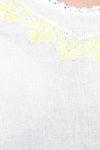 Misha Pyjama Suit with floral yellow embroidery detail on white fabric.