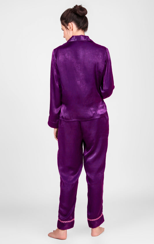 Purple satin pyjama suit for women, stylish and comfortable design.