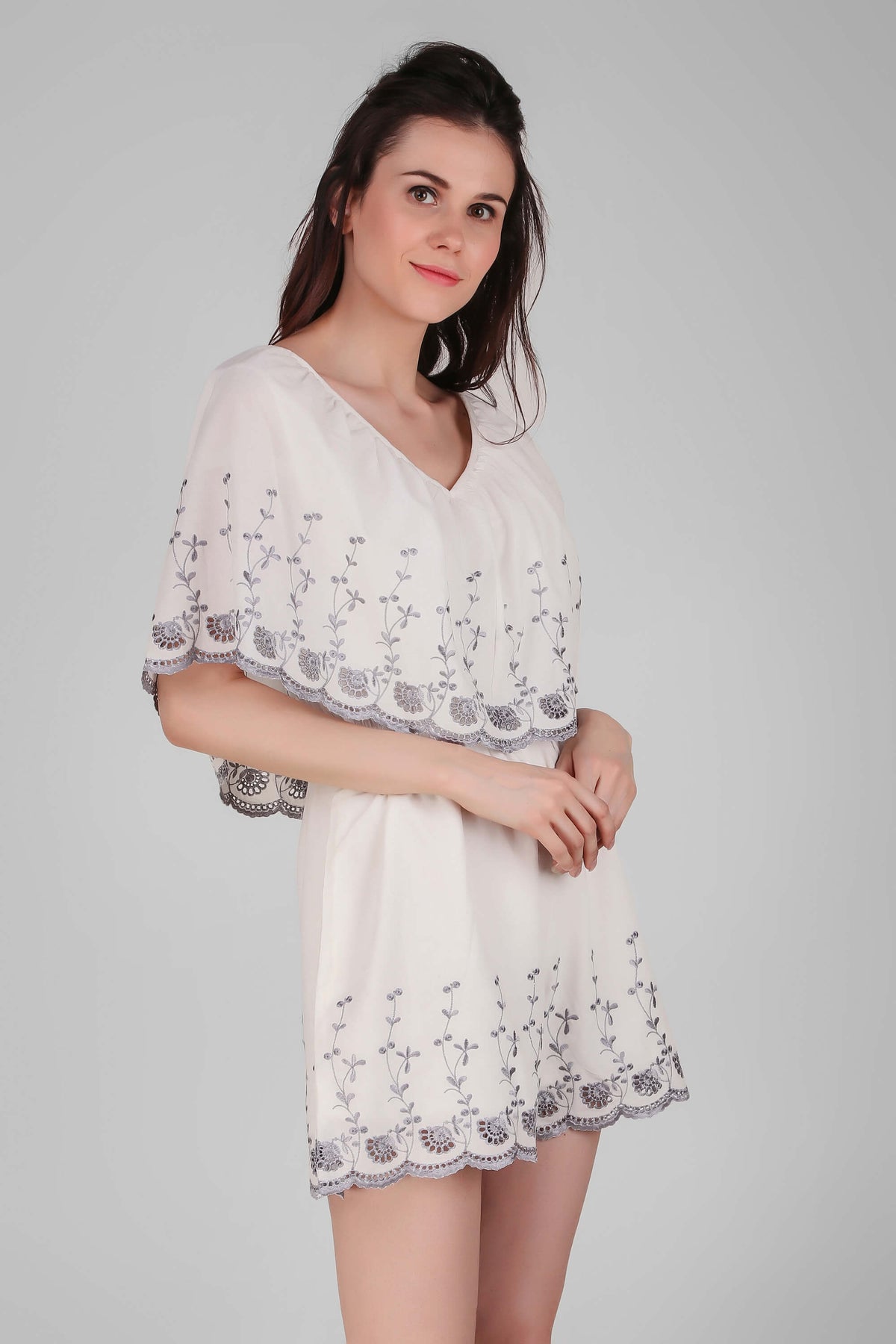 Elegant white Joyce romper with floral embroidery for women.