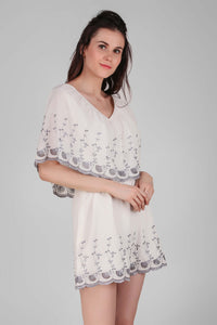 Elegant white Joyce romper with floral embroidery for women.