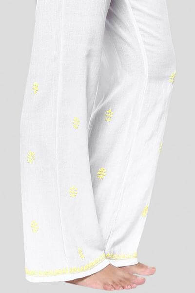 Misha Pyjama Suit in white fabric with yellow embroidery details.